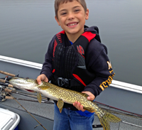 image of young fisherman holding Northern Pike